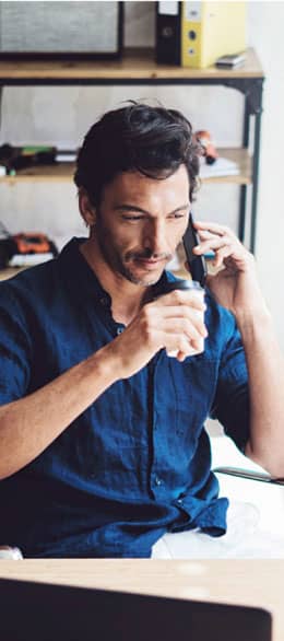 img - businessman-talking-on-mobile-phone-at-office
