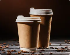 img - close-shot-disposable-cups-rustic-wooden-table-spilled-coffee-beans