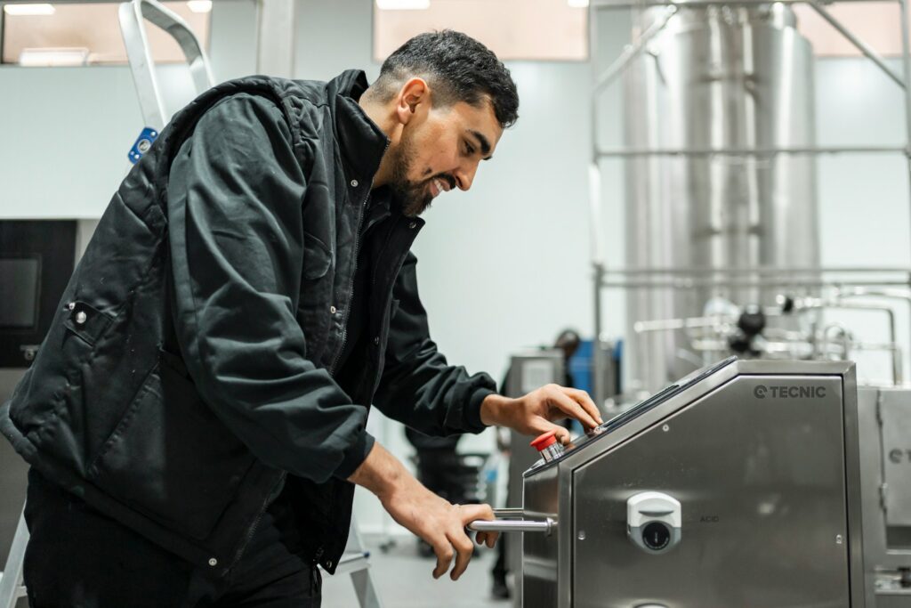 Technician performing maintenance on beverage equipment, reflecting the PM work covered in a service program.