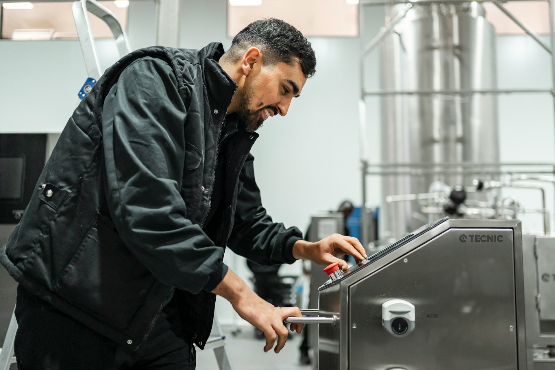 Technician performing maintenance on beverage equipment, reflecting the PM work covered in a service program.