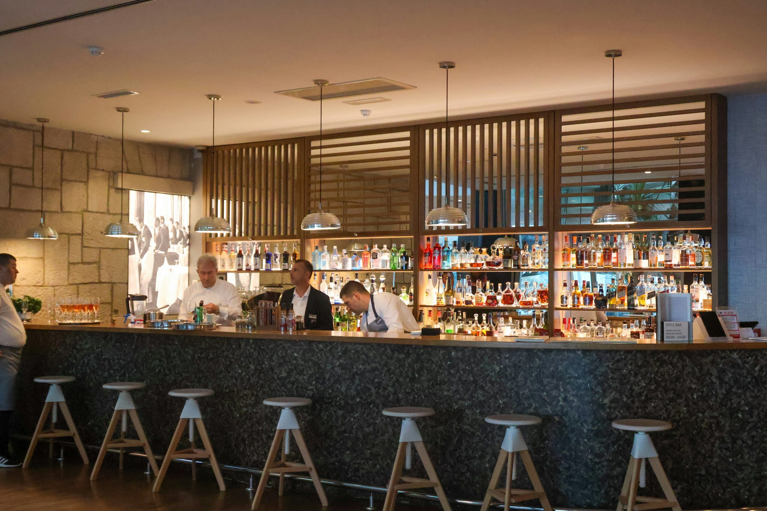 A staffed hotel bar with full liquor selection, one of the multiple venues a hotel beverage program supports.
