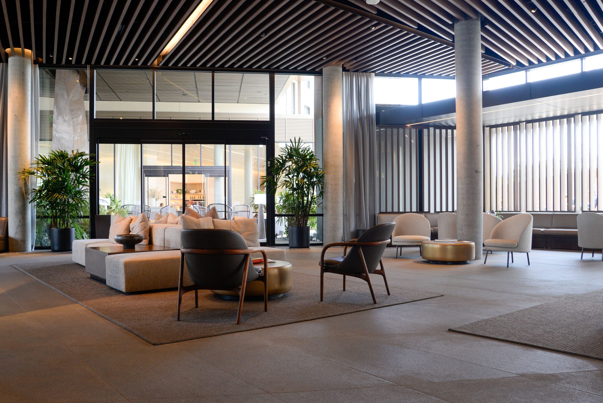 Modern hotel lobby seating area illustrating the guest-facing environment where a self-service coffee station can provide convenient beverage access throughout the day.