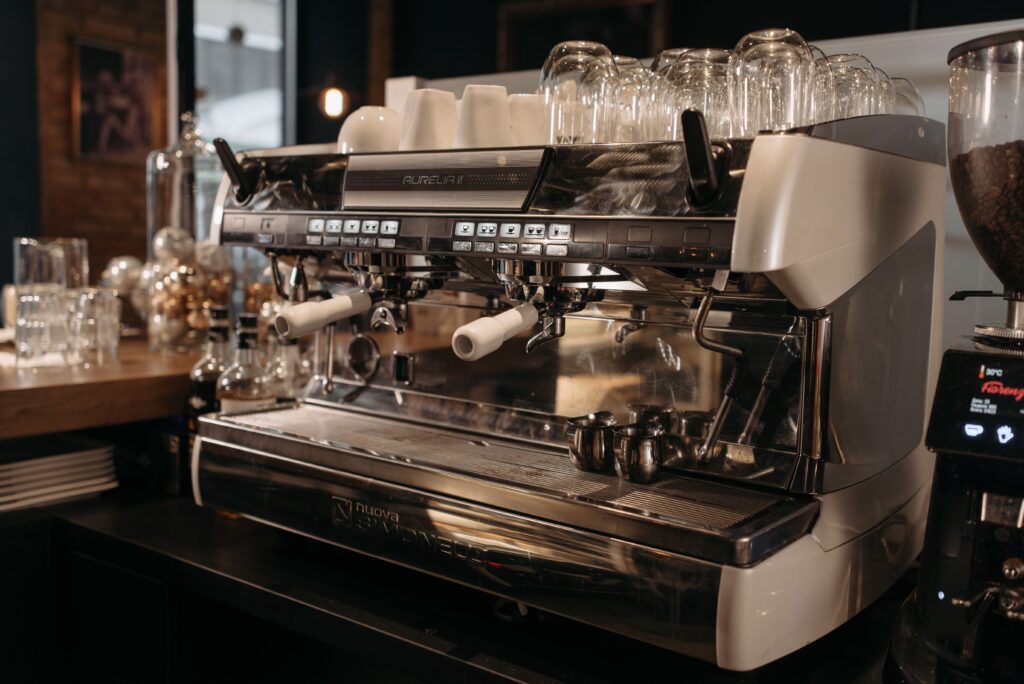 Commercial coffee machine in a foodservice setting requiring routine troubleshooting and maintenance.